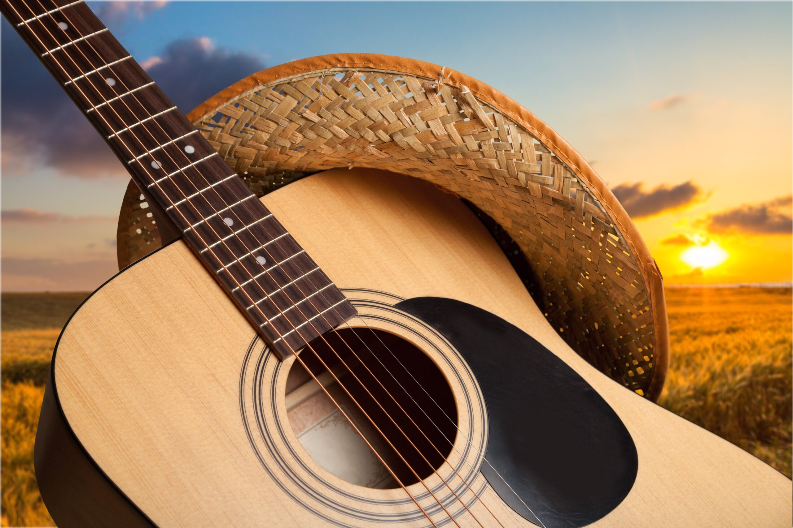 Acoustic guitar close up on background